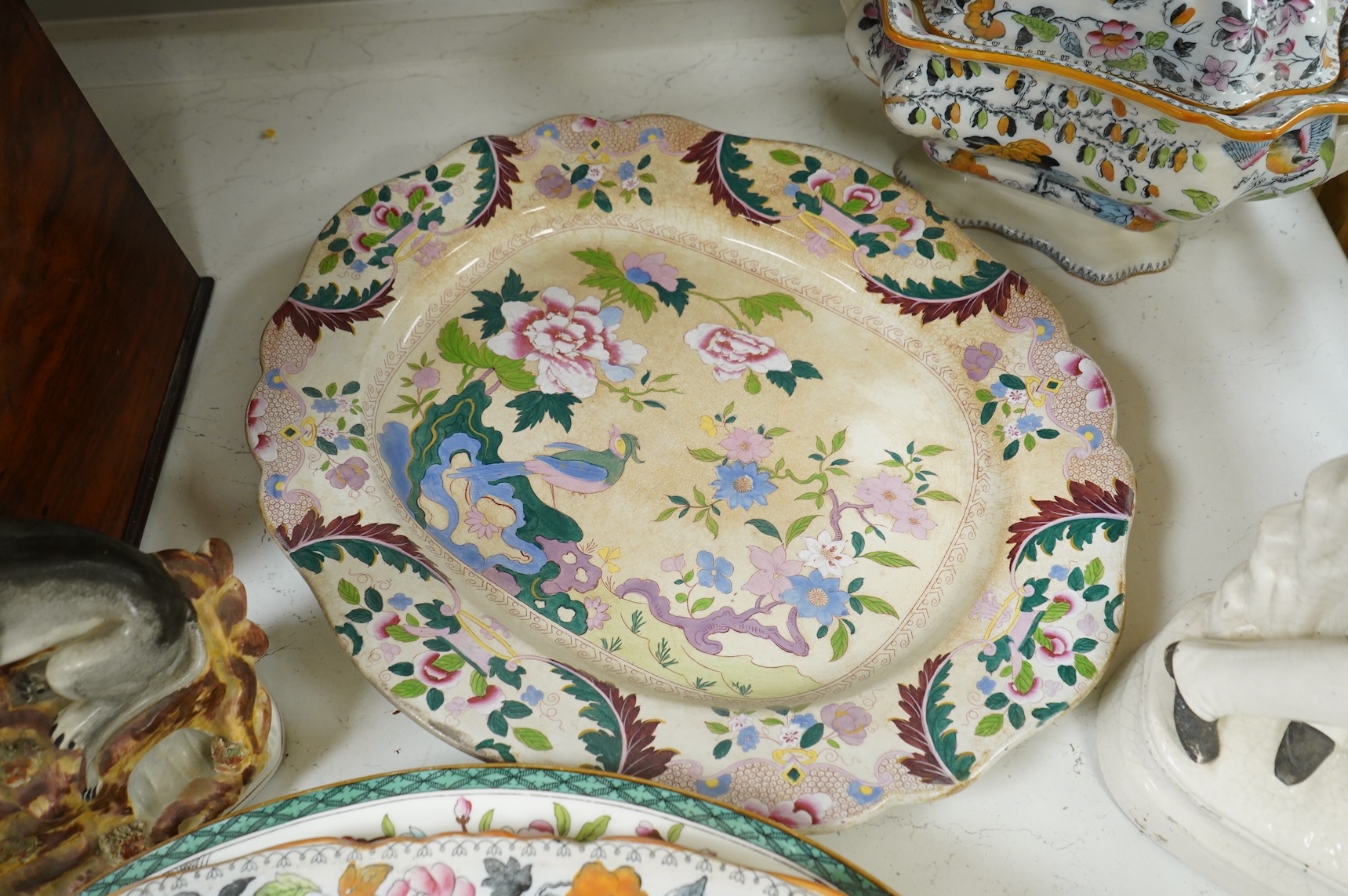 Three 19th century Staffordshire figures, including General Garibaldi, a Staffordshire pottery soup tureen and four serving plates, largest 48cm wide